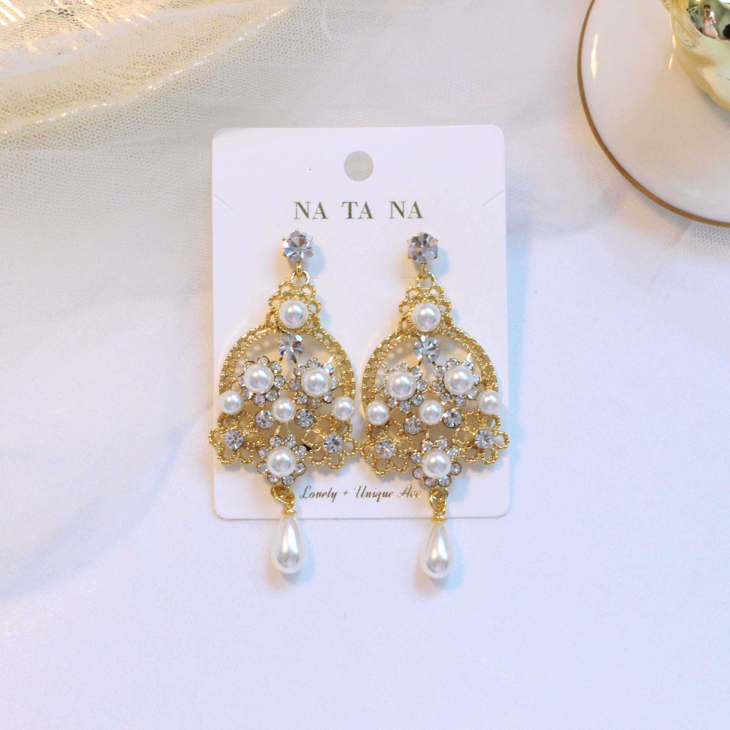 Bird pearl cubic bold drop earrings ornate titaniu