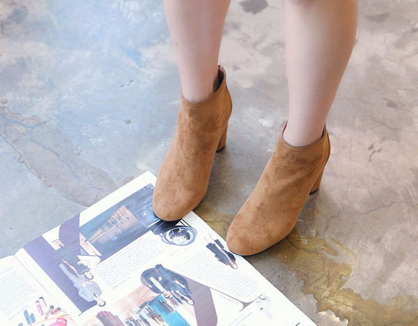 RN 7179 Suede high heel ankle boots A woman in her