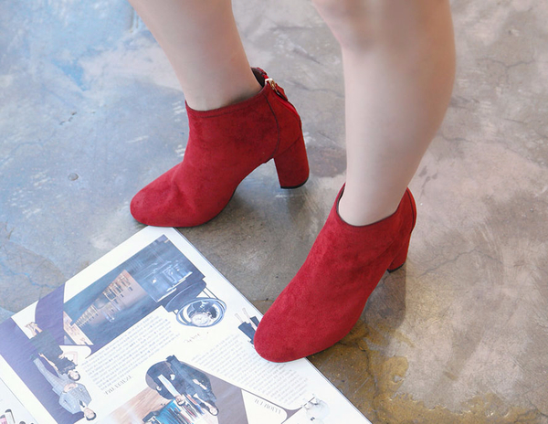 RN 7179 Suede high heel ankle boots A woman in her